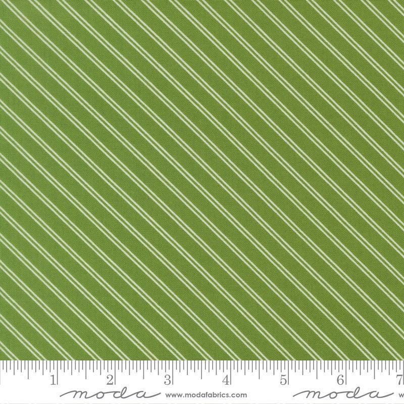 Image of Bloomsberry Stripe Green quilting cotton fabric by Camille Roskelley for Moda Fabrics. Features stripes on a green background. Cute Little Fabric Shop.