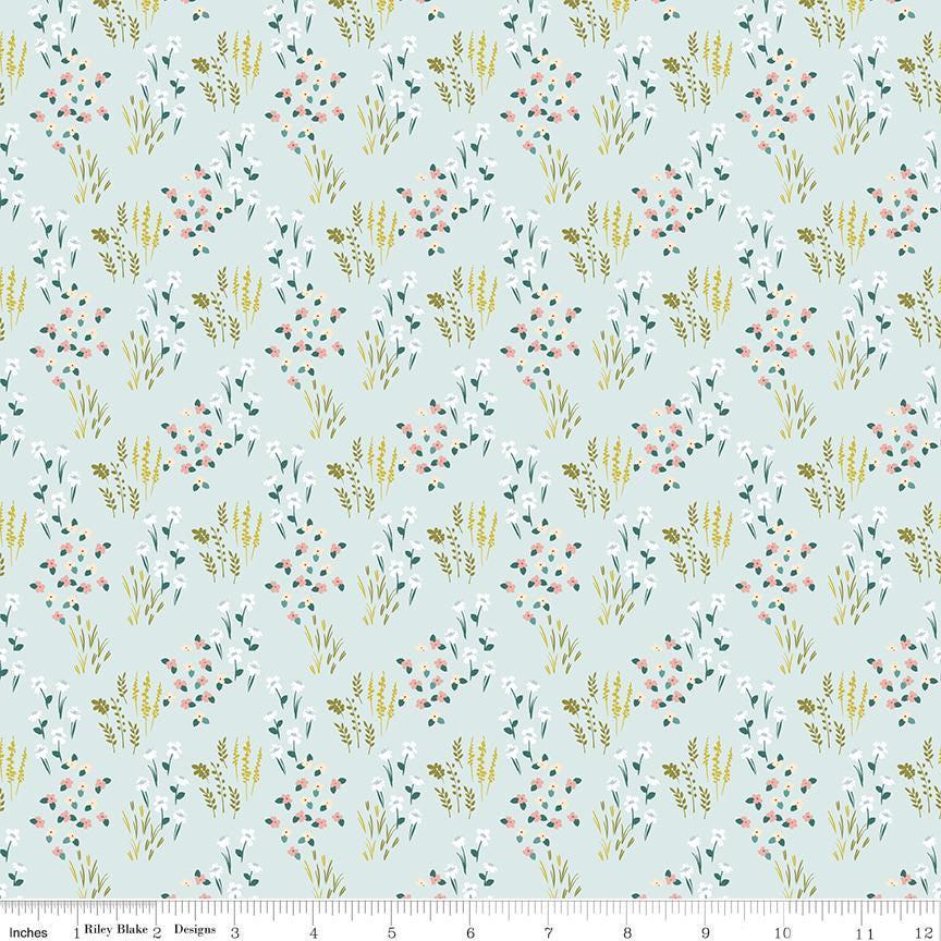 Image of Petals & Hazel Meadow Powder quilting cotton fabric by Simple Simon & Company for Riley Blake Designs. Features flowers on a blue background. Cute Little Fabric Shop.
