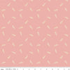 Image of Petals & Hazel Toss Coral quilting cotton fabric by Simple Simon & Company for Riley Blake Designs. Features leaves on a pink background. Cute Little Fabric Shop.