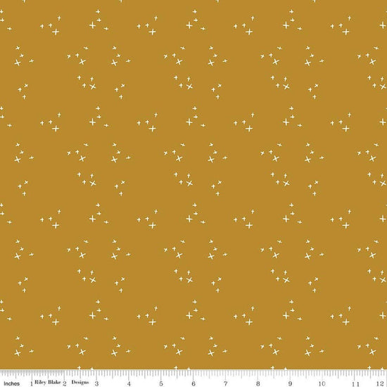 Image of Petals & Hazel Scatter Butterscotch quilting cotton fabric by Simple Simon & Company for Riley Blake Designs. Features stars on a gold background. Cute Little Fabric Shop.