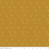Image of Petals & Hazel Scatter Butterscotch quilting cotton fabric by Simple Simon & Company for Riley Blake Designs. Features stars on a gold background. Cute Little Fabric Shop.