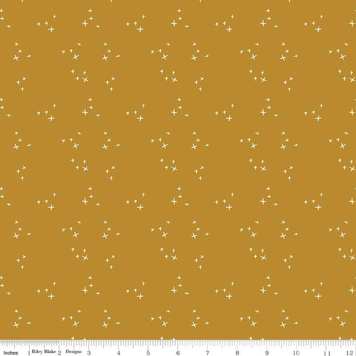 Image of Petals & Hazel Scatter Butterscotch quilting cotton fabric by Simple Simon & Company for Riley Blake Designs. Features stars on a gold background. Cute Little Fabric Shop.