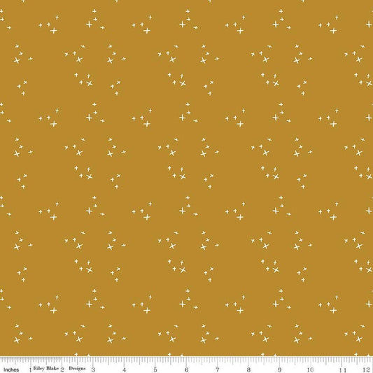 Image of Petals & Hazel Scatter Butterscotch quilting cotton fabric by Simple Simon & Company for Riley Blake Designs. Features stars on a gold background. Cute Little Fabric Shop.