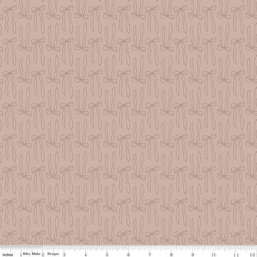Image of Charmed & Treasured Bows Doe by Kassidy Grace for Riley Blake Designs. Features bows on a brown background. Cute Little Fabric Shop.