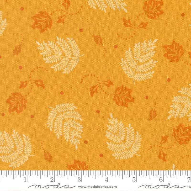 Image of Sitara Paisley Leaf Dijon quilting cotton fabric by Crystal Manning for Moda Fabrics. Features leaves on a yellow background. Cute Little Fabric Shop.
