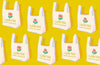 Image of Sparkle Mart Have a Nice Day Golden Hour quilting cotton fabric by Melody Miller of Ruby Star Society for Moda Fabrics. Features shopping bags on a yellow background. Cute Little Fabric Shop.
