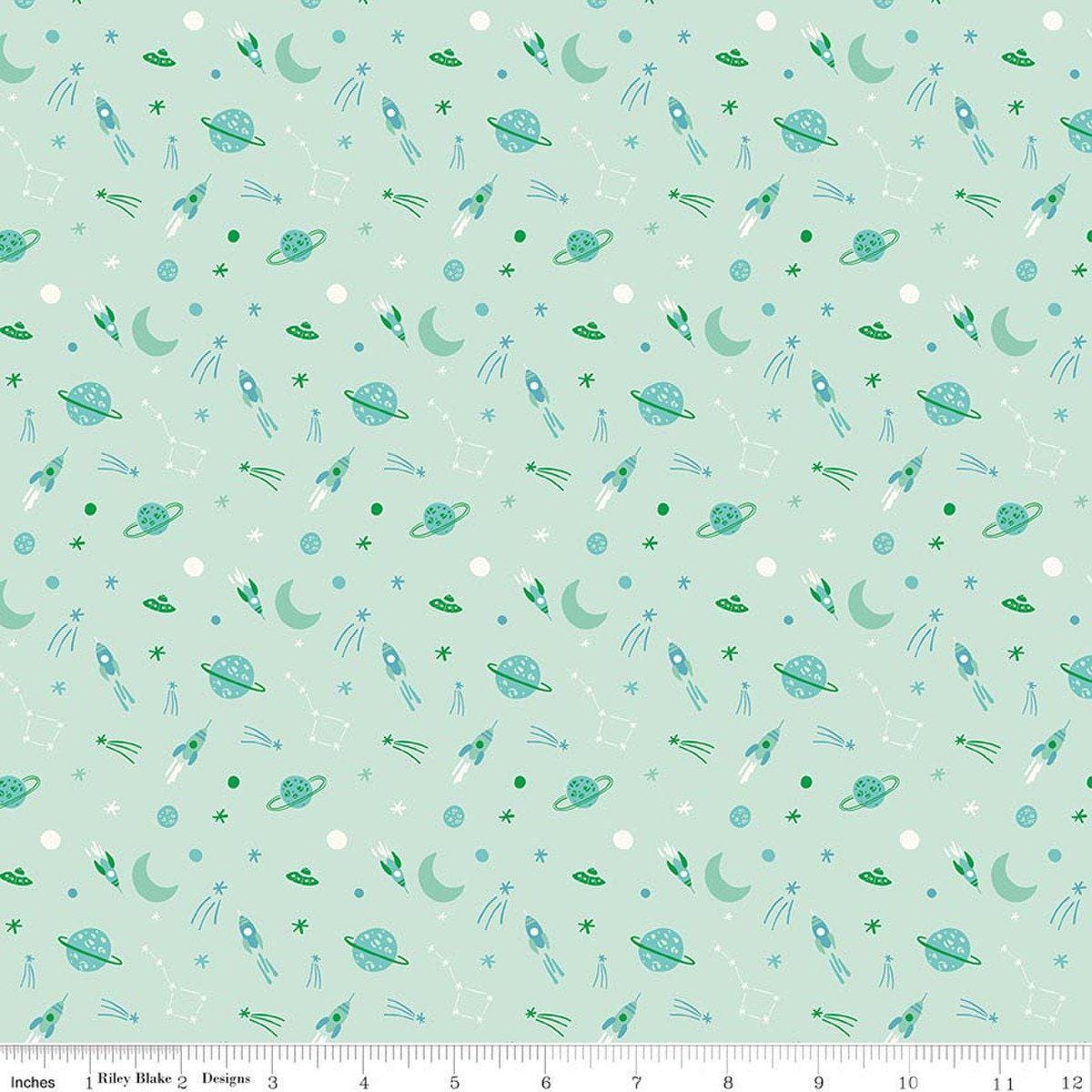 Image of Brave Your Way To the Moon Mint quilting cotton fabric by Cayla Naylor for Riley Blake Designs. Features space on a green background. Cute Little Fabric Shop.