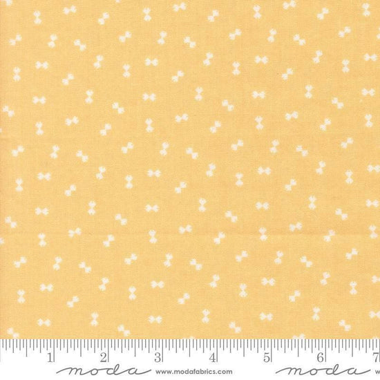 Image of Handmade Sweetness Confetti Butterscotch quilting cotton fabric by My Sew Quilty Life for Moda Fabrics. Features bows on a yellow background. Cute Little Fabric Shop.