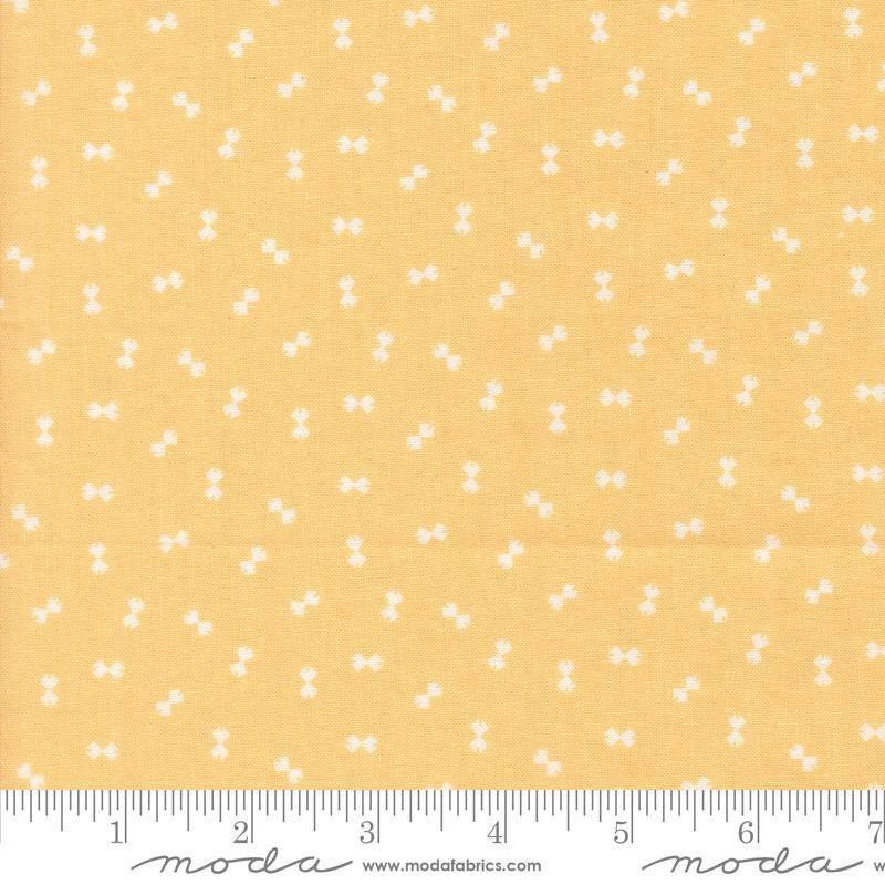 Image of Handmade Sweetness Confetti Butterscotch quilting cotton fabric by My Sew Quilty Life for Moda Fabrics. Features bows on a yellow background. Cute Little Fabric Shop.