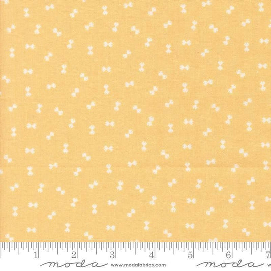 Image of Handmade Sweetness Confetti Butterscotch quilting cotton fabric by My Sew Quilty Life for Moda Fabrics. Features bows on a yellow background. Cute Little Fabric Shop.