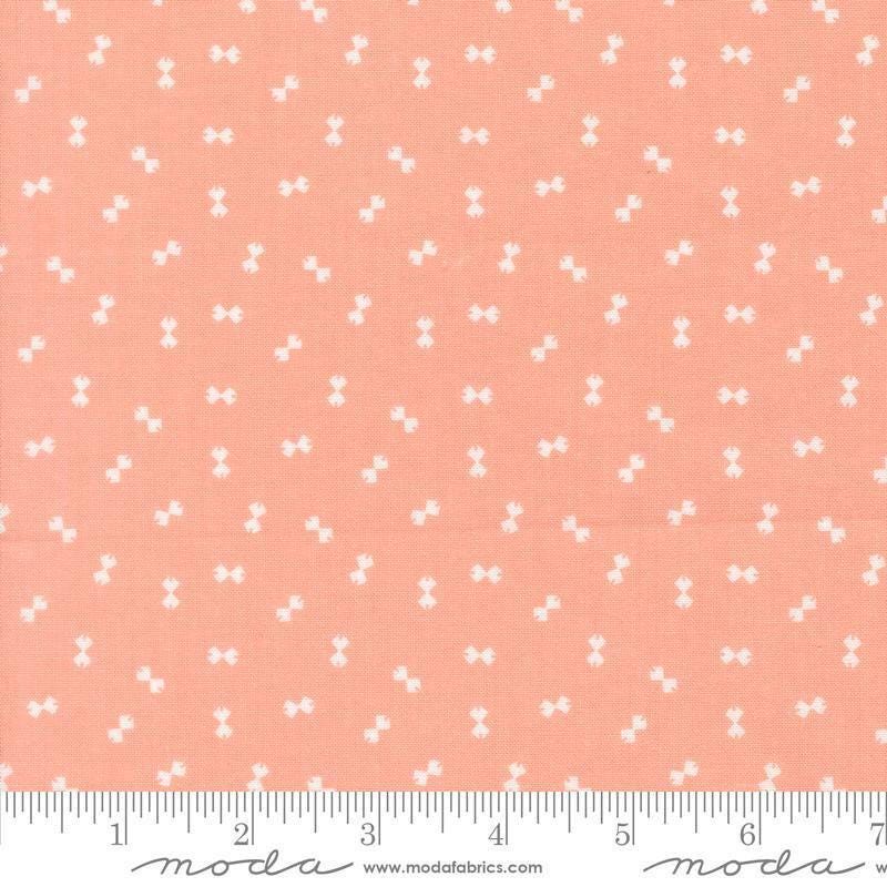 Image of Handmade Sweetness Confetti Peach quilting cotton fabric by My Sew Quilty Life for Moda Fabrics. Features bows on a pink background. Cute Little Fabric Shop.