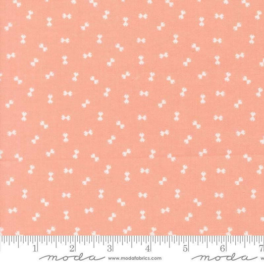 Image of Handmade Sweetness Confetti Peach quilting cotton fabric by My Sew Quilty Life for Moda Fabrics. Features bows on a pink background. Cute Little Fabric Shop.