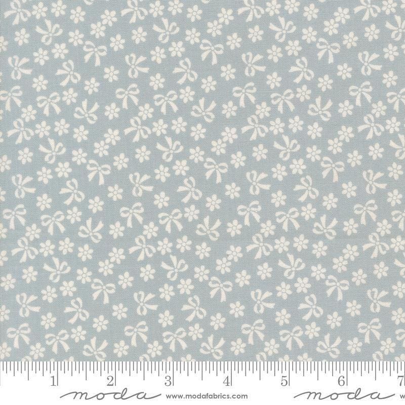 Image of Handmade Sweetness Bows Powder Blue quilting cotton fabric by My Sew Quilty Life for Moda Fabrics. Features flowers on a blue background. Cute Little Fabric Shop.