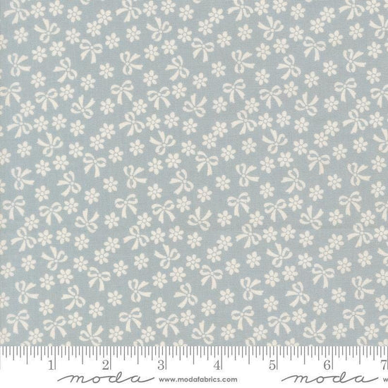 Image of Handmade Sweetness Bows Powder Blue quilting cotton fabric by My Sew Quilty Life for Moda Fabrics. Features flowers on a blue background. Cute Little Fabric Shop.