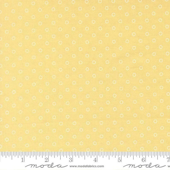 Image of Bloomsberry Favorite Dot Buttermilk quilting cotton fabric by Camille Roskelley for Moda Fabrics. Features tonal polka dots on a yellow background. Cute Little Fabric Shop.