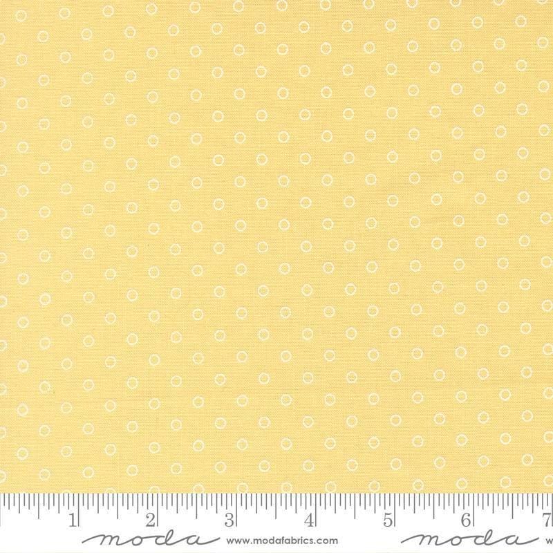 Image of Bloomsberry Favorite Dot Buttermilk quilting cotton fabric by Camille Roskelley for Moda Fabrics. Features tonal polka dots on a yellow background. Cute Little Fabric Shop.