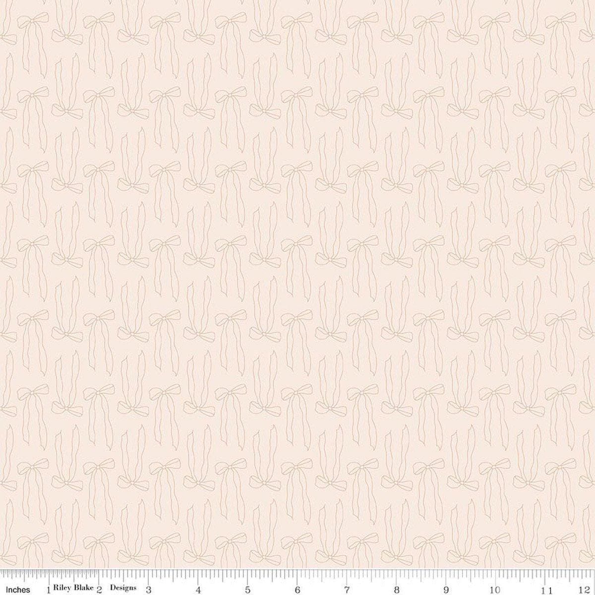 Image of Charmed & Treasured Bows Latte by Kassidy Grace for Riley Blake Designs. Features bows on a cream background. Cute Little Fabric Shop.