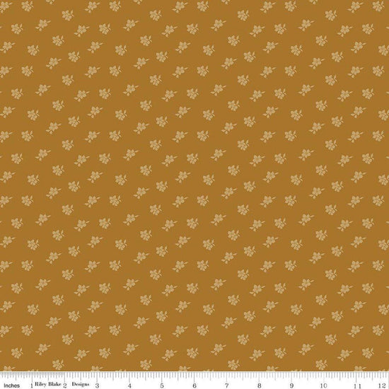 Image of Charmed & Treasured Magnolia Suede by Kassidy Grace for Riley Blake Designs. Features flowers on a gold background. Cute Little Fabric Shop.