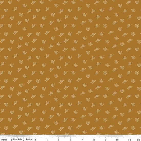 Image of Charmed & Treasured Magnolia Suede by Kassidy Grace for Riley Blake Designs. Features flowers on a gold background. Cute Little Fabric Shop.