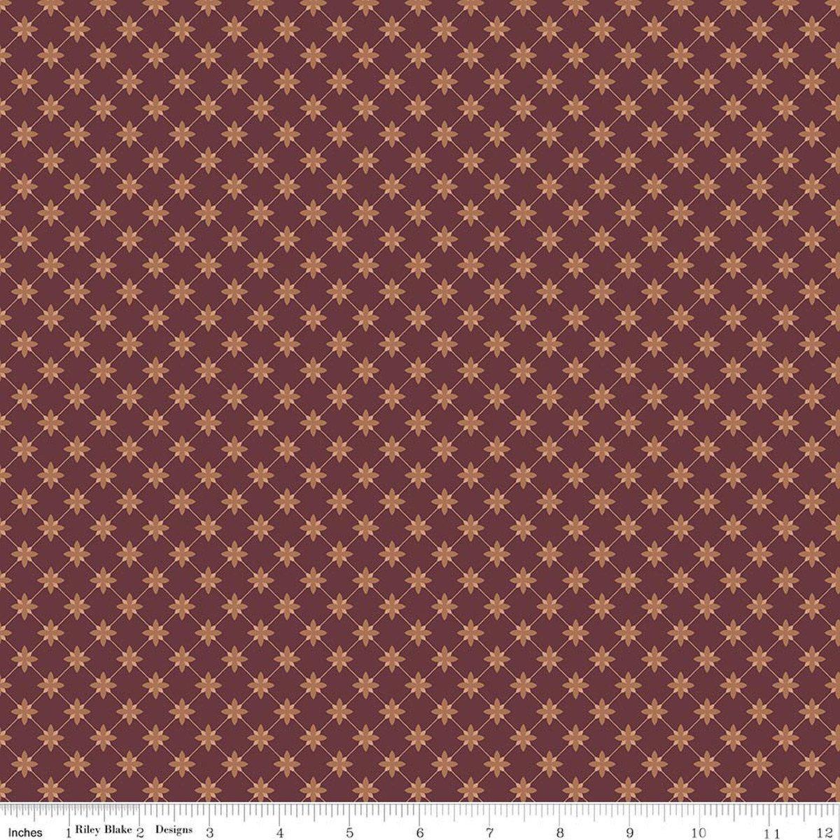 Image of Charmed & Treasured Stella Mahogany by Kassidy Grace for Riley Blake Designs. Features a geometric pattern on a reddish brown background. Cute Little Fabric Shop.