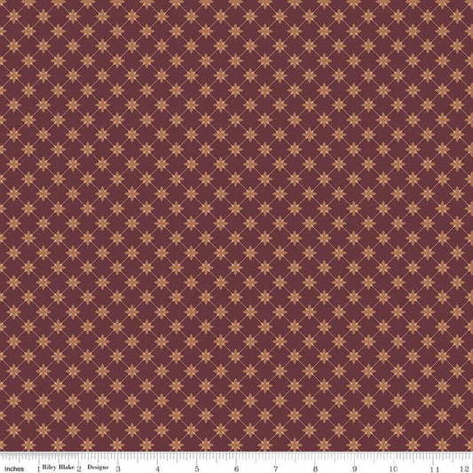 Image of Charmed & Treasured Stella Mahogany by Kassidy Grace for Riley Blake Designs. Features a geometric pattern on a reddish brown background. Cute Little Fabric Shop.