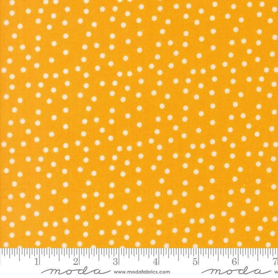 Image of Makers Delight Small Dot Chrome by Chrissy Lux for Moda Fabrics. Features polka dots on a yellow background. Cute Little Fabric Shop.