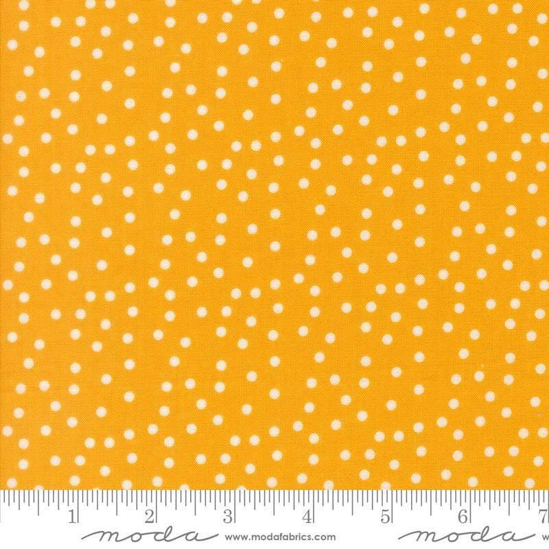 Image of Makers Delight Small Dot Chrome by Chrissy Lux for Moda Fabrics. Features polka dots on a yellow background. Cute Little Fabric Shop.