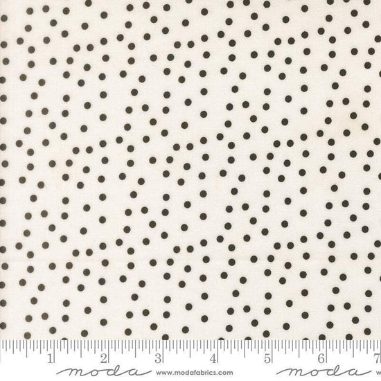 Image of Makers Delight Small Dot White Black by Chrissy Lux for Moda Fabrics. Features polka dots on a white background. Cute Little Fabric Shop.