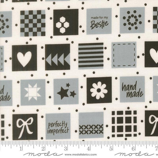Image of Makers Delight Handmade Labels Platinum by Chrissy Lux for Moda Fabrics. Features squares on a gray background. Cute Little Fabric Shop.
