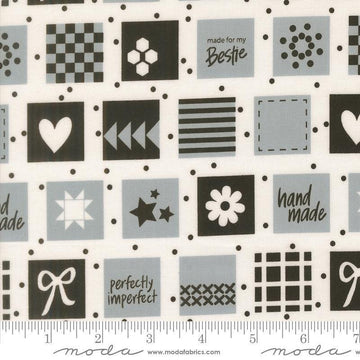 Image of Makers Delight Handmade Labels Platinum by Chrissy Lux for Moda Fabrics. Features squares on a gray background. Cute Little Fabric Shop.