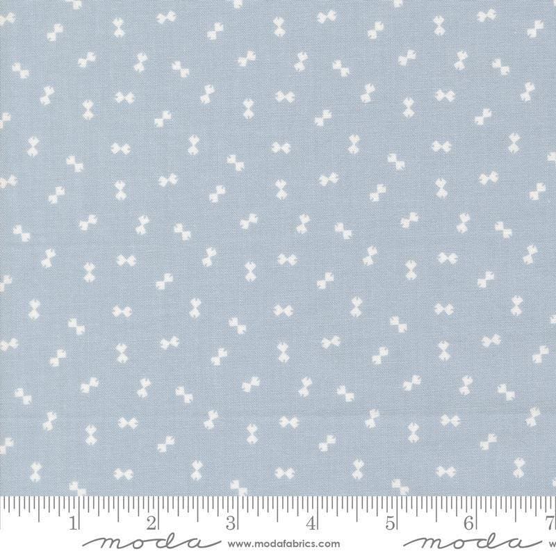Image of Handmade Sweetness Confetti Powder Blue quilting cotton fabric by My Sew Quilty Life for Moda Fabrics. Features bows on a blue background. Cute Little Fabric Shop.