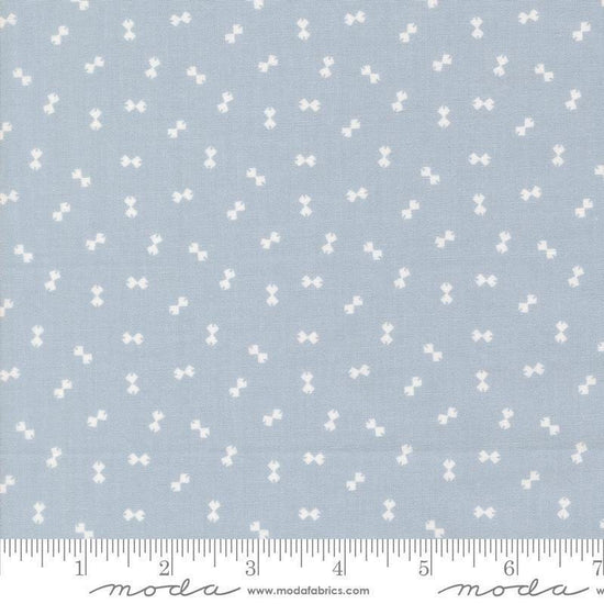 Image of Handmade Sweetness Confetti Powder Blue quilting cotton fabric by My Sew Quilty Life for Moda Fabrics. Features bows on a blue background. Cute Little Fabric Shop.