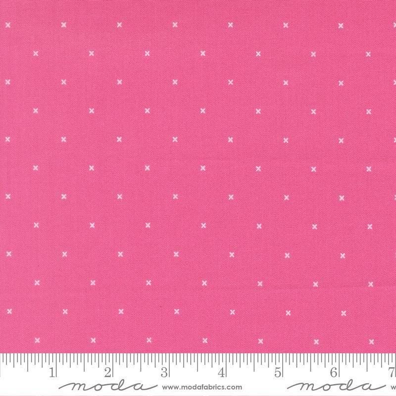 Image of Joysome Tiny Peel Petunia quilting cotton fabric by Corey Yoder for Moda Fabrics. Features tiny xs on a pink background. Cute Little Fabric Shop.
