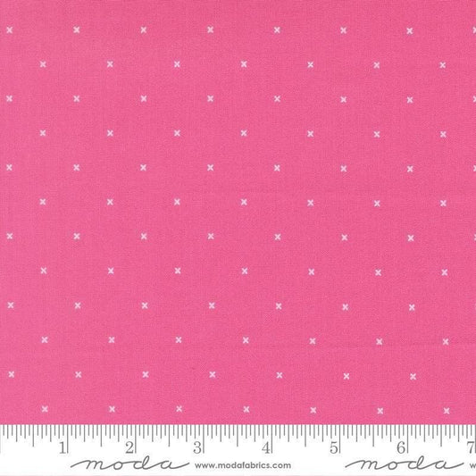Image of Joysome Tiny Peel Petunia quilting cotton fabric by Corey Yoder for Moda Fabrics. Features tiny xs on a pink background. Cute Little Fabric Shop.