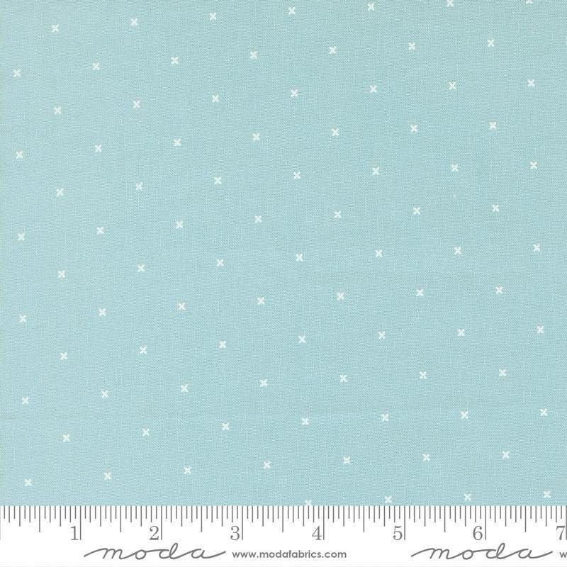 Image of Joysome Tiny Peel Sky quilting cotton fabric by Corey Yoder for Moda Fabrics. Features tiny xs on a blue background. Cute Little Fabric Shop.