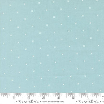 Image of Joysome Tiny Peel Sky quilting cotton fabric by Corey Yoder for Moda Fabrics. Features tiny xs on a blue background. Cute Little Fabric Shop.