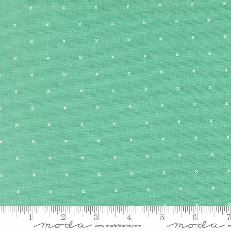 Image of Joysome Tiny Peel Peacock quilting cotton fabric by Corey Yoder for Moda Fabrics. Features tiny xs on a green blue background. Cute Little Fabric Shop.