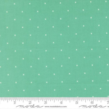 Image of Joysome Tiny Peel Peacock quilting cotton fabric by Corey Yoder for Moda Fabrics. Features tiny xs on a green blue background. Cute Little Fabric Shop.