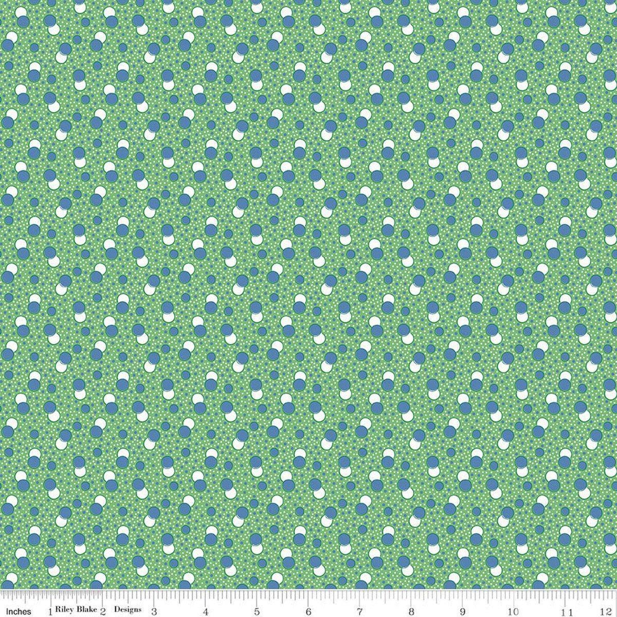 Image of Traditional 30's Dots Green quilting cotton fabric by Lindsay Wilkes for Riley Blake Designs. Features polka dots on a green background. Cute Little Fabric Shop.