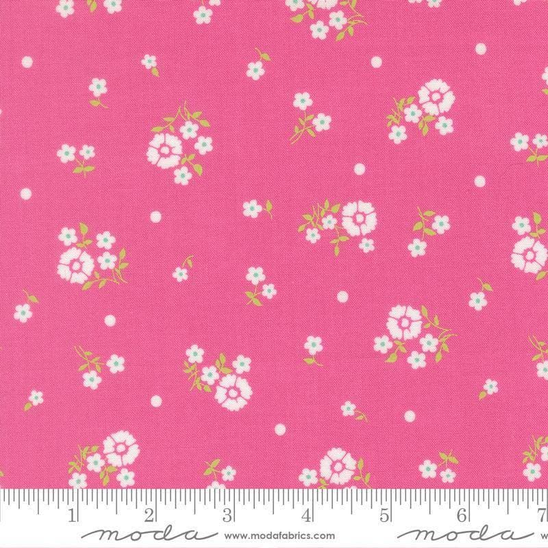 Image of Joysome Hand Picked Petunia quilting cotton fabric by Corey Yoder for Moda Fabrics. Features flowers on a pink background. Cute Little Fabric Shop.