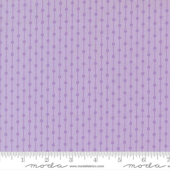 Image of Joysome Jelly Bracelet Wisteria quilting cotton fabric by Corey Yoder for Moda Fabrics. Features stripes and dots on a purple background. Cute Little Fabric Shop.
