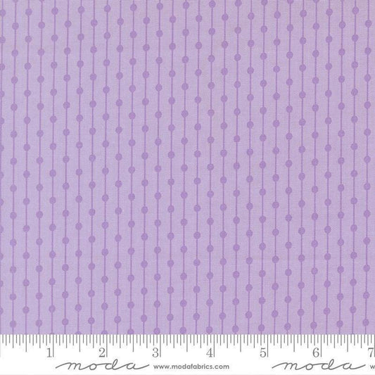 Image of Joysome Jelly Bracelet Wisteria quilting cotton fabric by Corey Yoder for Moda Fabrics. Features stripes and dots on a purple background. Cute Little Fabric Shop.