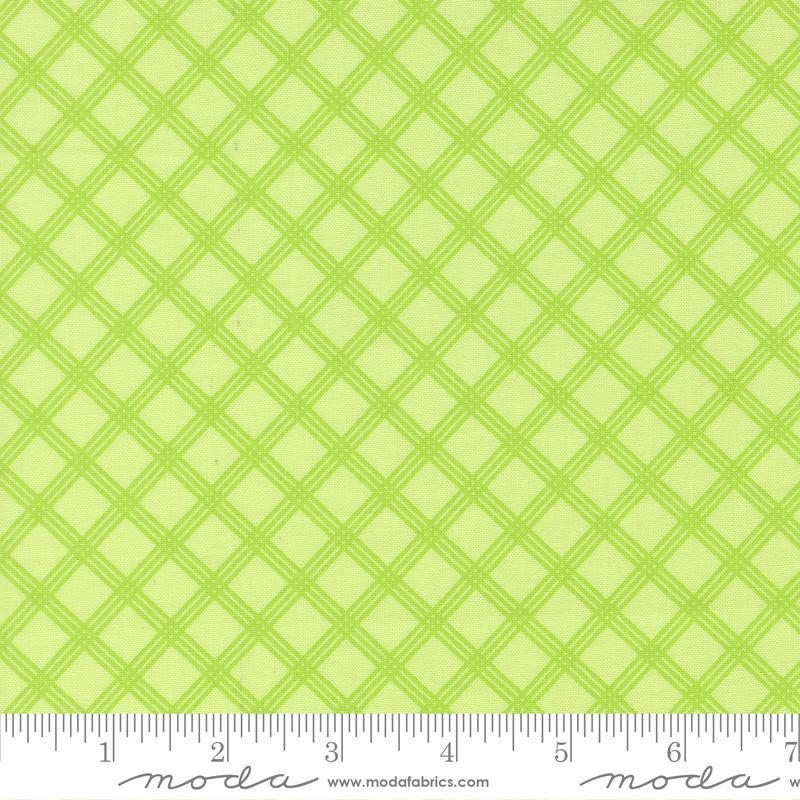 Image of Joysome Charming Check Honeydew quilting cotton fabric by Corey Yoder for Moda Fabrics. Features a geometric pattern on a green background. Cute Little Fabric Shop.