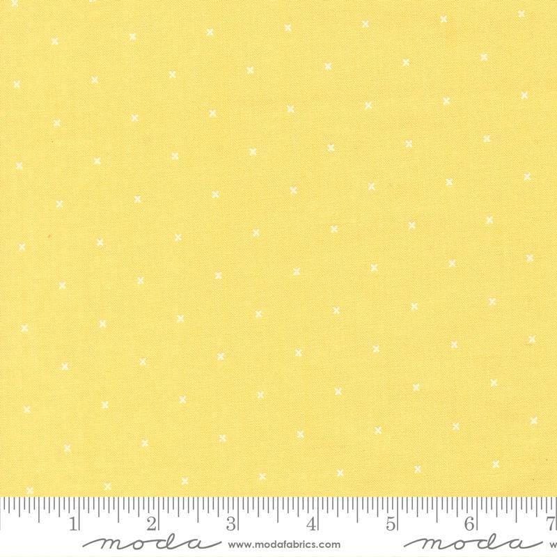 Image of Joysome Tiny Peel Sunshine quilting cotton fabric by Corey Yoder for Moda Fabrics. Features tiny xs on a yellow background. Cute Little Fabric Shop.