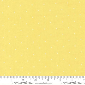 Image of Joysome Tiny Peel Sunshine quilting cotton fabric by Corey Yoder for Moda Fabrics. Features tiny xs on a yellow background. Cute Little Fabric Shop.