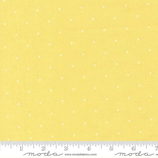 Image of Joysome Tiny Peel Sunshine quilting cotton fabric by Corey Yoder for Moda Fabrics. Features tiny xs on a yellow background. Cute Little Fabric Shop.