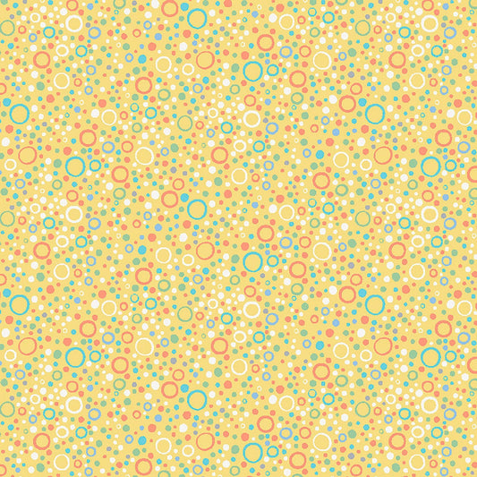 Image of Little Squirt Bubbles Icy Yellow quilting cotton fabric by Morris Creative Group for QT Fabrics. Features circles on a yellow background. Cute Little Fabric Shop.