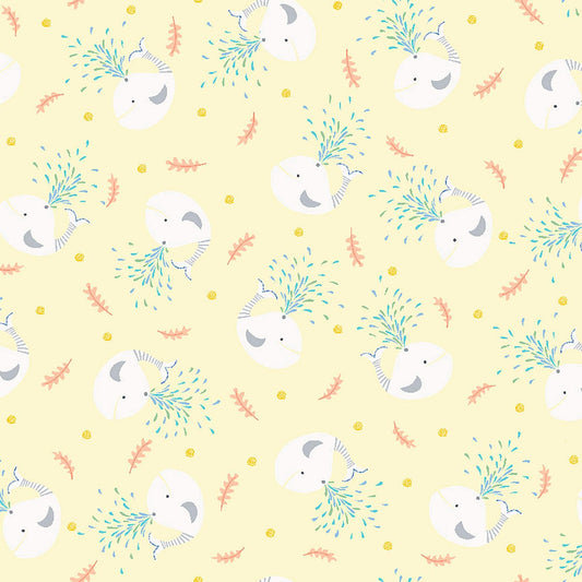 Image of Little Squirt Tossed Whale Pale Yellow quilting cotton fabric by Morris Creative Group for QT Fabrics. Features whales on a yellow background. Cute Little Fabric Shop.