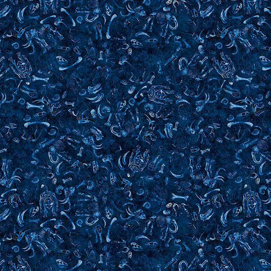 Image of Terrors of the Pleistocene Fossil Bed Navy quilting cotton fabric by Morris Creative Group for QT Fabrics. Features bones on a blue background. Cute Little Fabric Shop.