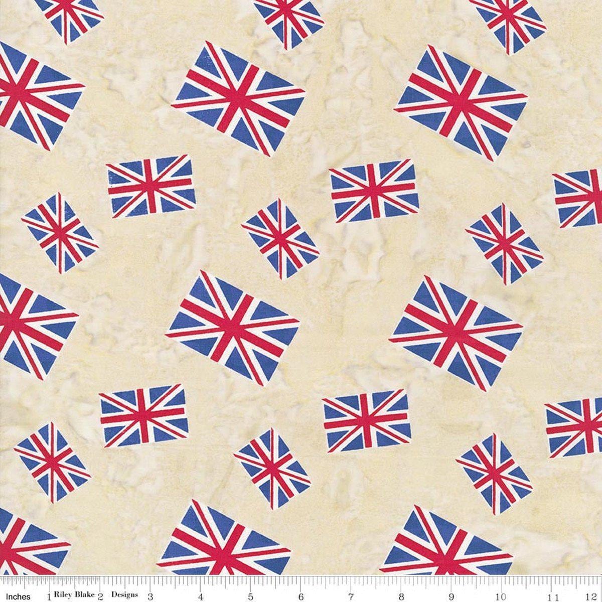 Image of Batiks Around the World London Toasted Almond quilting cotton fabric by Tara Reed for Riley Blake Designs. Features the british flag on a cream background. Cute Little Fabric Shop.